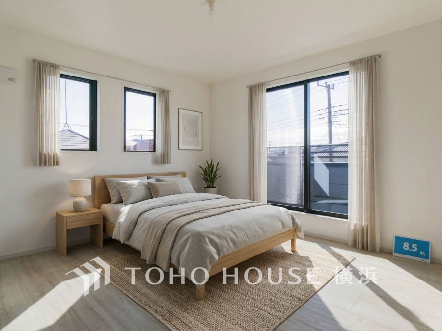 自然光がたっぷり入る8.5帖の明るい洋室。シンプルなインテリアで落ち着いた空間を演出しています。（装飾品はAI家具です）